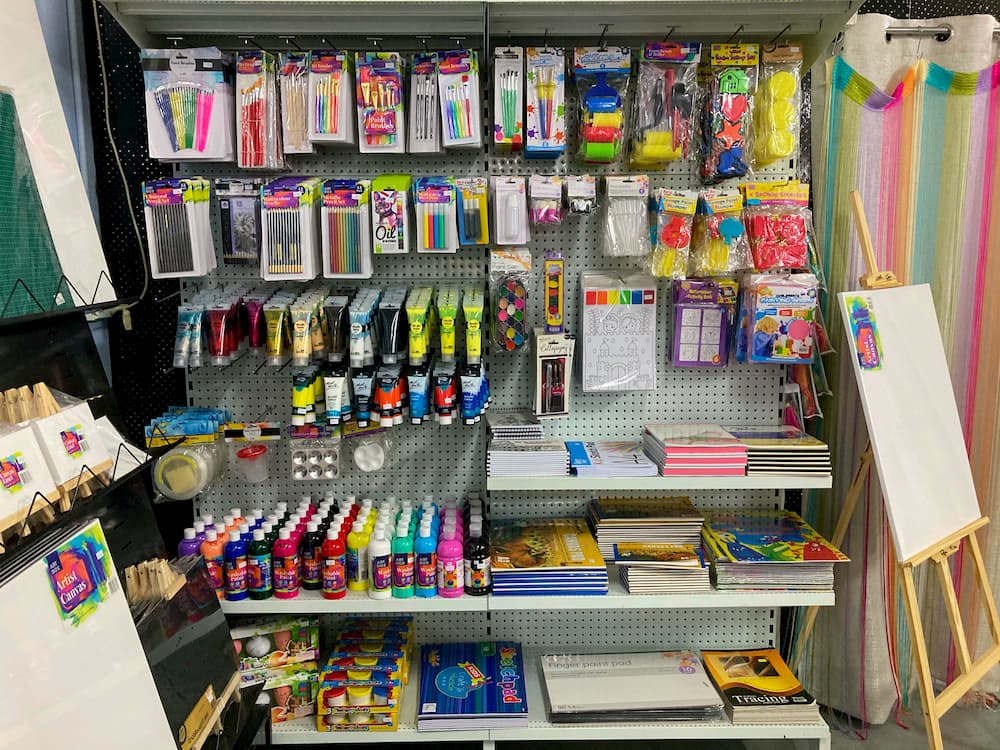 Art supplies, including paints, brushes, pencils, and canvases, easels, sketchbooks, and tracing pads.